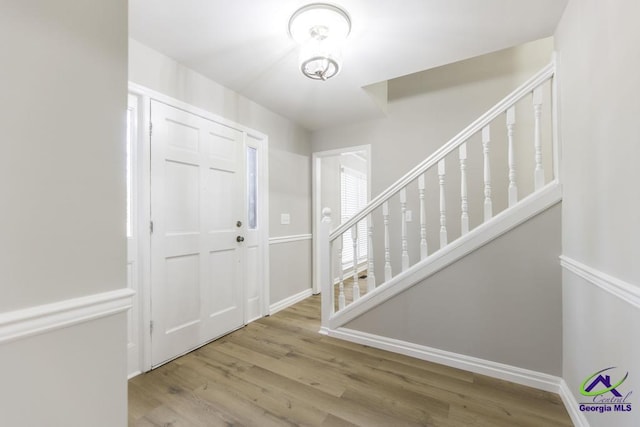 foyer entrance with light hardwood / wood-style flooring