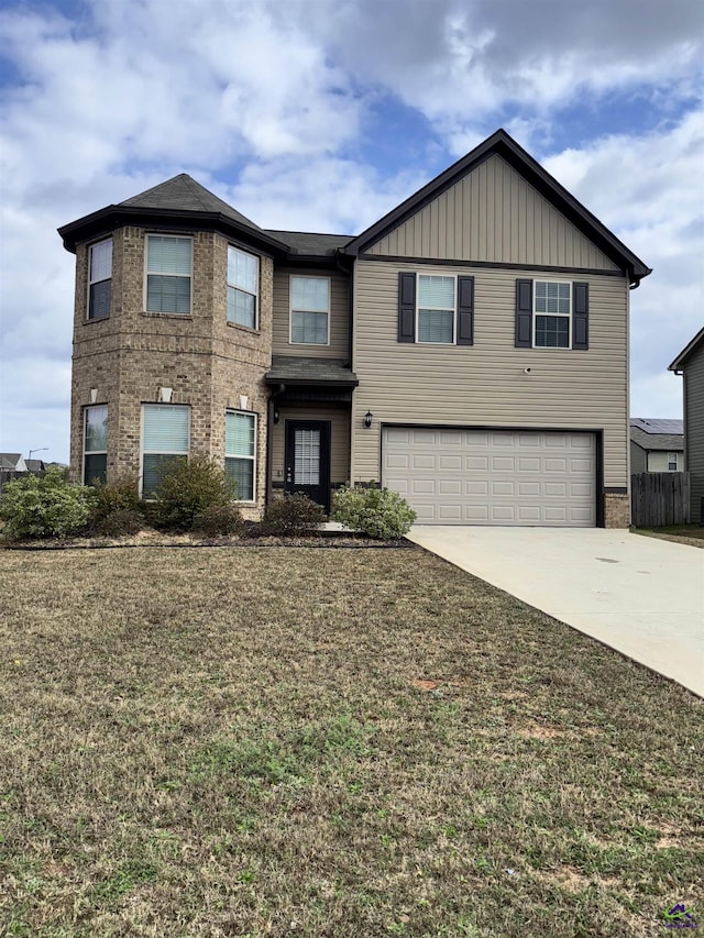 view of front of house featuring a garage and a front yard