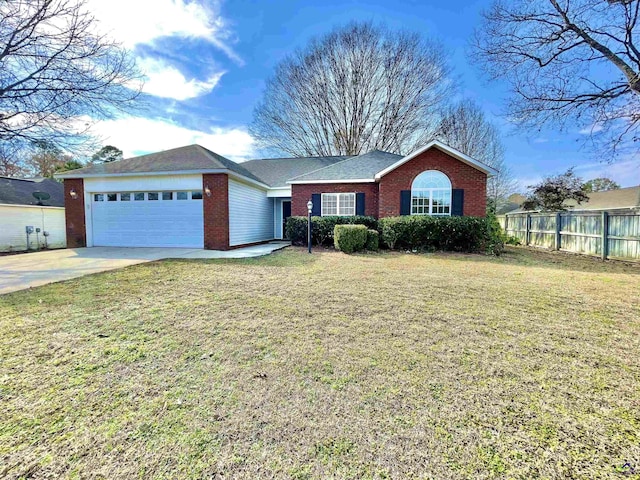 ranch-style house featuring a garage and a front lawn