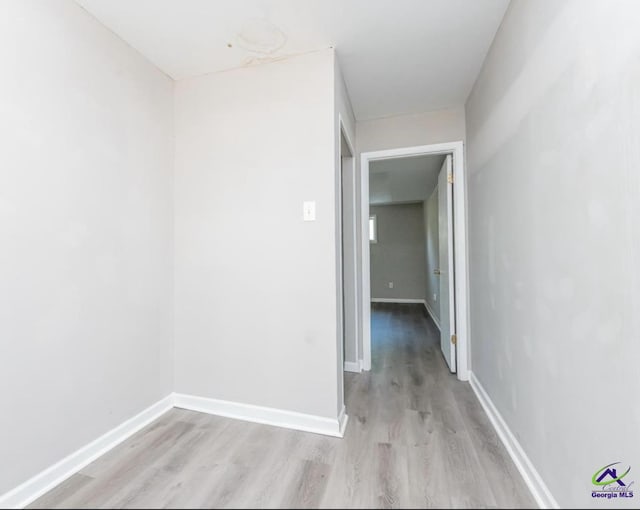 corridor featuring light hardwood / wood-style flooring