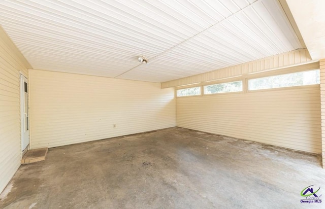 unfurnished room with concrete floors