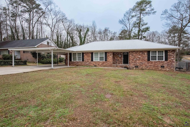 ranch-style home featuring a carport and a front lawn