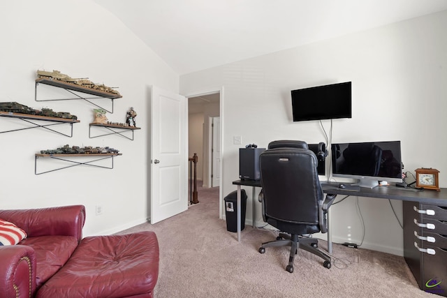 office space featuring lofted ceiling and light carpet