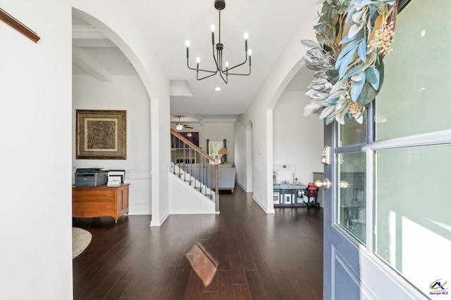 entrance foyer with ceiling fan, dark hardwood / wood-style floors, and beam ceiling