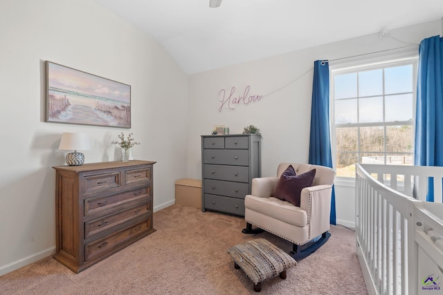 bedroom featuring lofted ceiling and light colored carpet