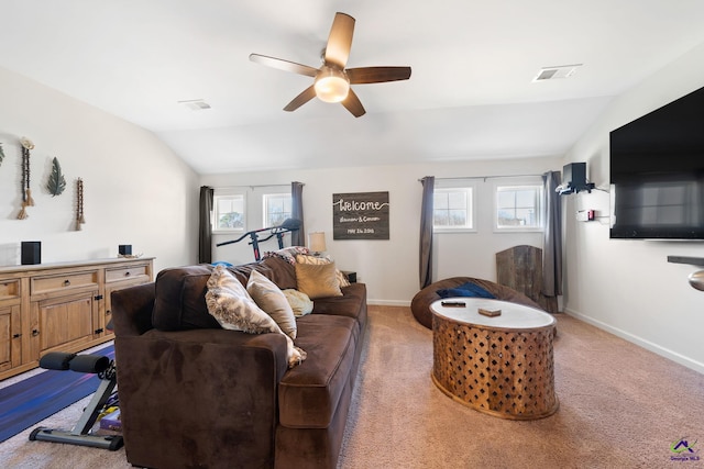 living room featuring lofted ceiling, ceiling fan, and carpet