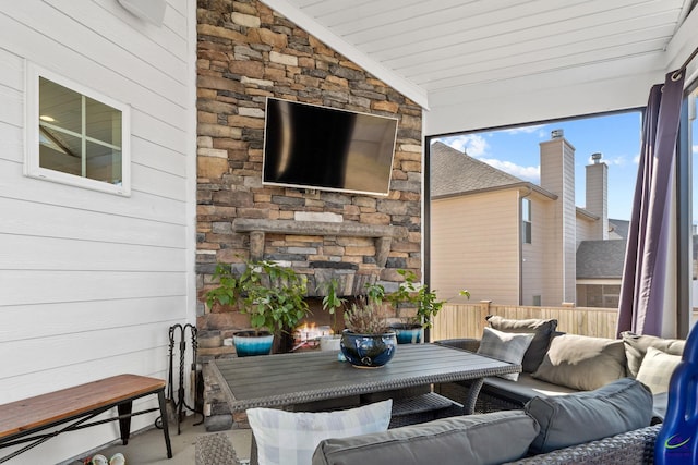 view of patio featuring an outdoor living space with a fireplace