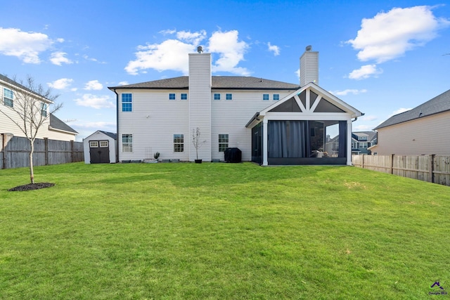 rear view of house featuring central AC unit, a yard, a storage shed, and a sunroom