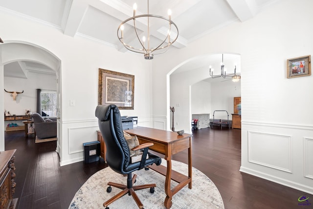 office space featuring an inviting chandelier, ornamental molding, dark hardwood / wood-style floors, and beamed ceiling