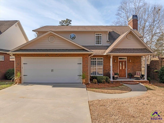 view of front facade with a garage and a porch