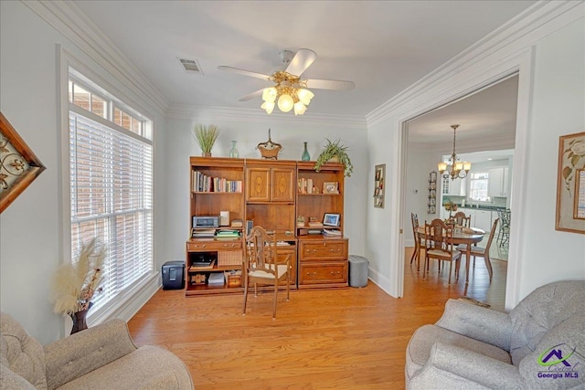 office space featuring ceiling fan with notable chandelier, ornamental molding, and light wood-type flooring