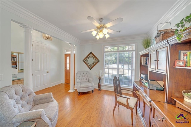 home office featuring decorative columns, crown molding, ceiling fan, and light hardwood / wood-style floors