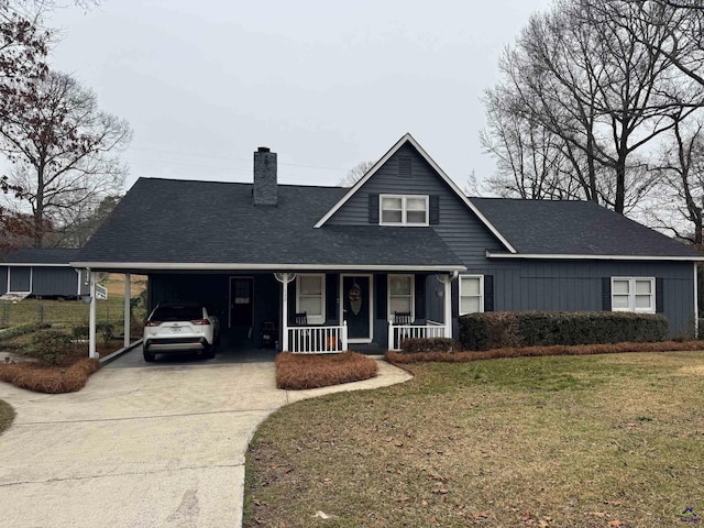 view of front of property with a carport, covered porch, and a front lawn