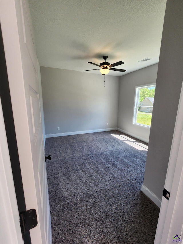 111 Silver Maple, Byron, GA 31008 - carpeted spare room featuring a textured ceiling, visible vents, baseboards, and ceiling fan