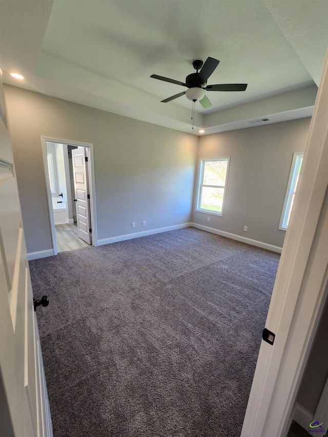 111 Silver Maple, Byron, GA 31008 - carpeted empty room with baseboards, a tray ceiling, recessed lighting, and a ceiling fan