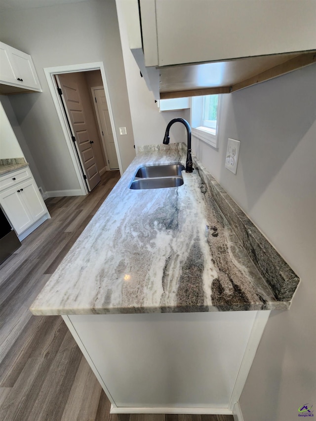 111 Silver Maple, Byron, GA 31008 - kitchen with white cabinetry, dark wood finished floors, light stone counters, and a sink