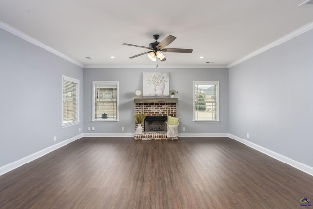 unfurnished living room with ornamental molding, a brick fireplace, ceiling fan, and dark hardwood / wood-style flooring