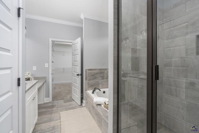 bathroom featuring vanity, ornamental molding, and shower with separate bathtub