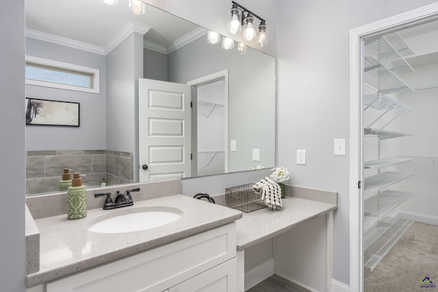 bathroom with crown molding and vanity