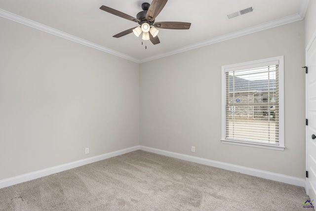 carpeted empty room featuring crown molding and ceiling fan