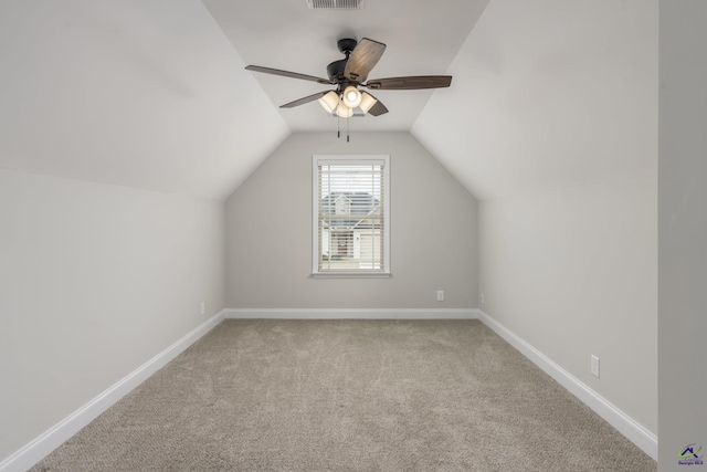 bonus room featuring ceiling fan, light colored carpet, and lofted ceiling