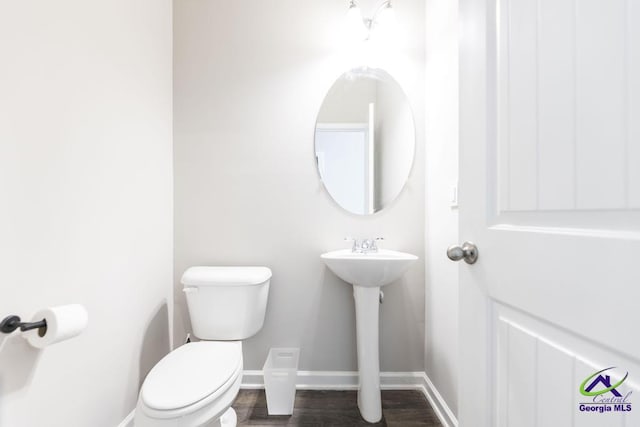 bathroom featuring toilet and hardwood / wood-style floors