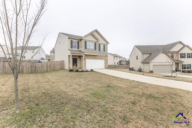 view of front of property featuring a front lawn and a garage