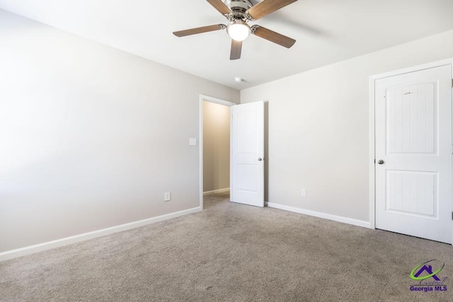 unfurnished bedroom with carpet and ceiling fan