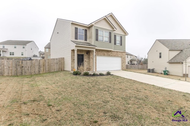 view of front of home featuring a garage, central air condition unit, and a front yard