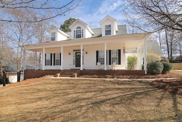 view of front of home with a front yard and covered porch