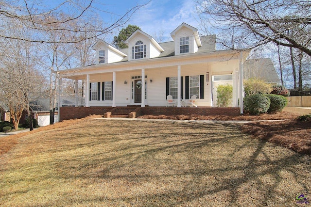 view of front facade with a porch and a front lawn