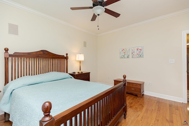 bedroom featuring ornamental molding, ceiling fan, and light wood-type flooring