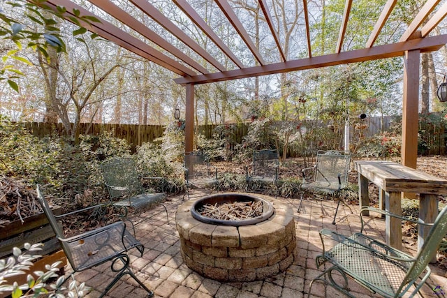 view of patio featuring an outdoor fire pit and a pergola