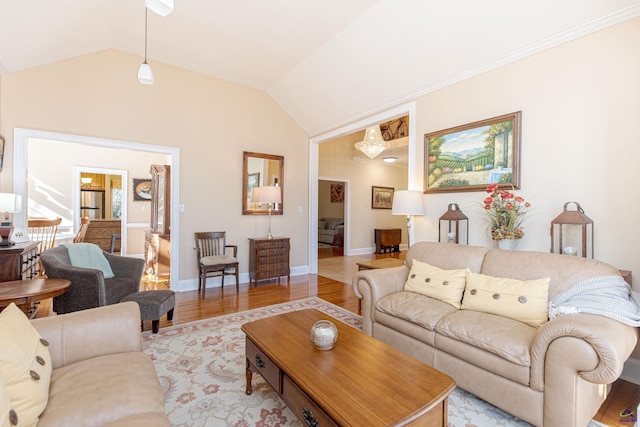 living room featuring lofted ceiling and light wood-type flooring