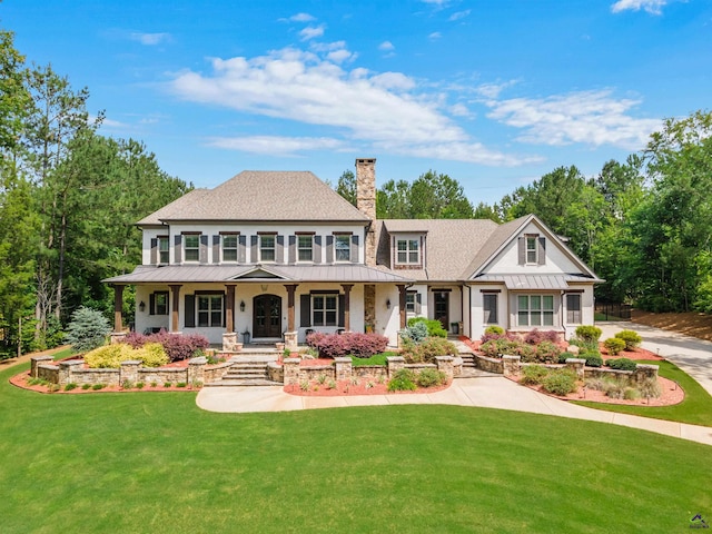 view of front facade featuring a front yard and a porch