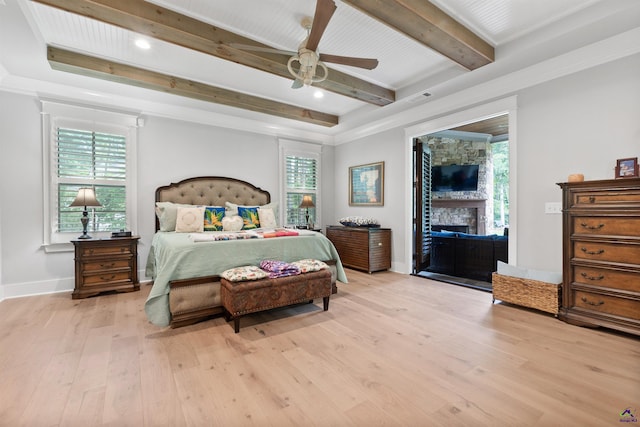 bedroom with ceiling fan, beam ceiling, light hardwood / wood-style flooring, and access to outside