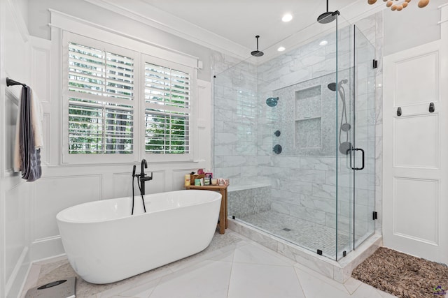 bathroom with crown molding and independent shower and bath