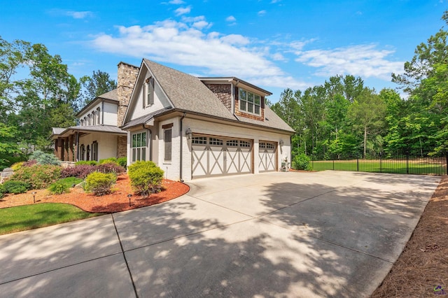 view of side of property with a garage