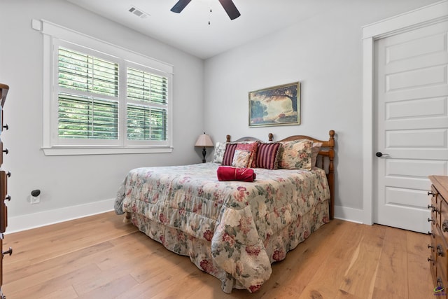 bedroom featuring ceiling fan and light hardwood / wood-style flooring