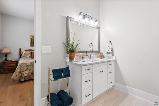 bathroom with vanity and hardwood / wood-style floors