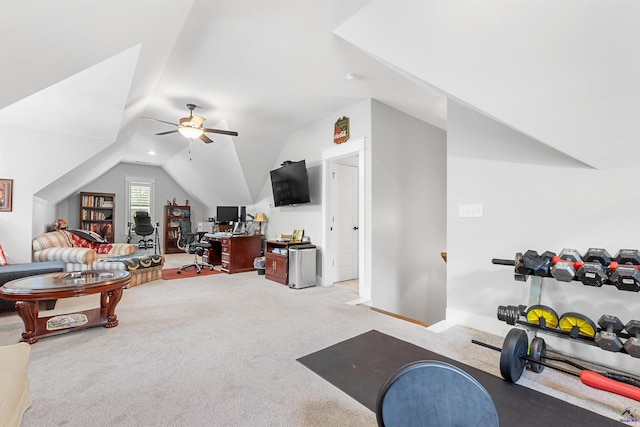 workout room featuring ceiling fan, lofted ceiling, and light carpet