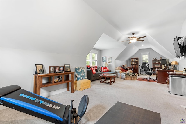 workout room featuring vaulted ceiling and carpet