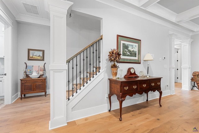 staircase with crown molding, wood-type flooring, decorative columns, and beamed ceiling