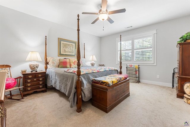 bedroom with ceiling fan and light carpet