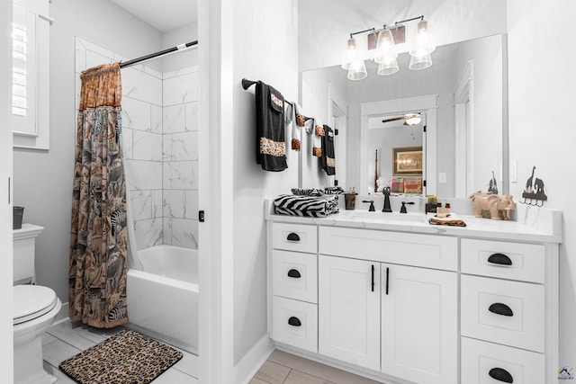 full bathroom featuring shower / bath combo, vanity, ceiling fan, and toilet