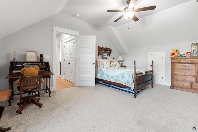 bedroom featuring light carpet, vaulted ceiling, and ceiling fan