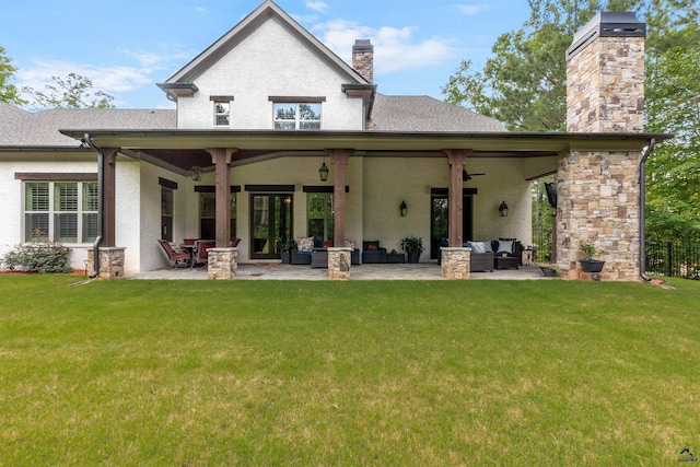 rear view of property with an outdoor hangout area, a lawn, ceiling fan, and a patio area