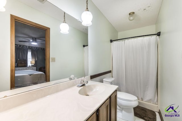 bathroom with vanity, toilet, and walk in shower