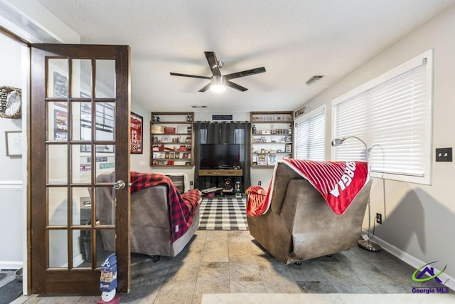 living room featuring ceiling fan