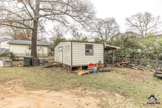 view of outbuilding featuring a yard